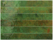 Glossy green 2x16 subway ceramic wall tile with shade variation, shown as a kitchen backsplash accent