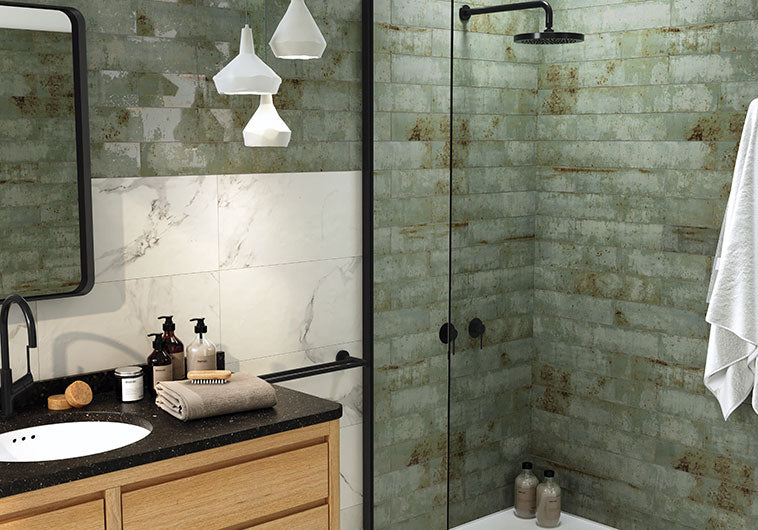 Herringbone pattern tile shower wall with matching floor tile featured on BELK Tile Shower Blog