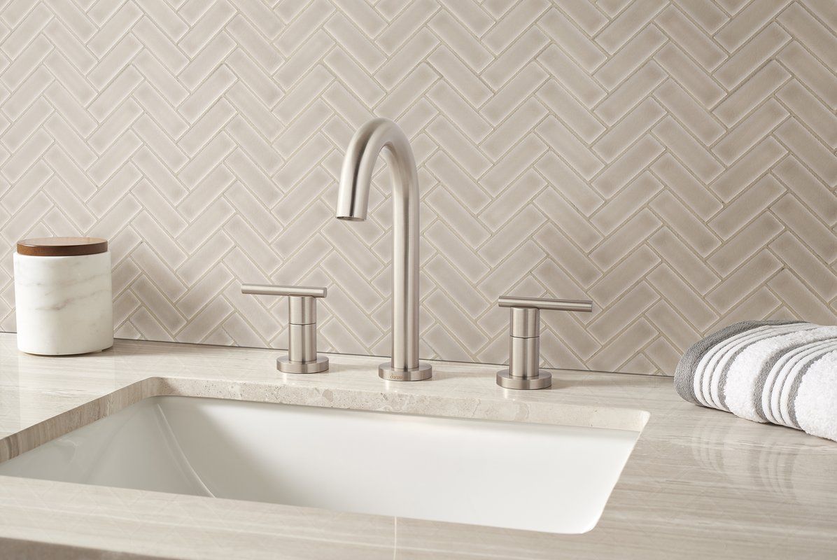 herringbone mosaic tile pattern vanity backsplash