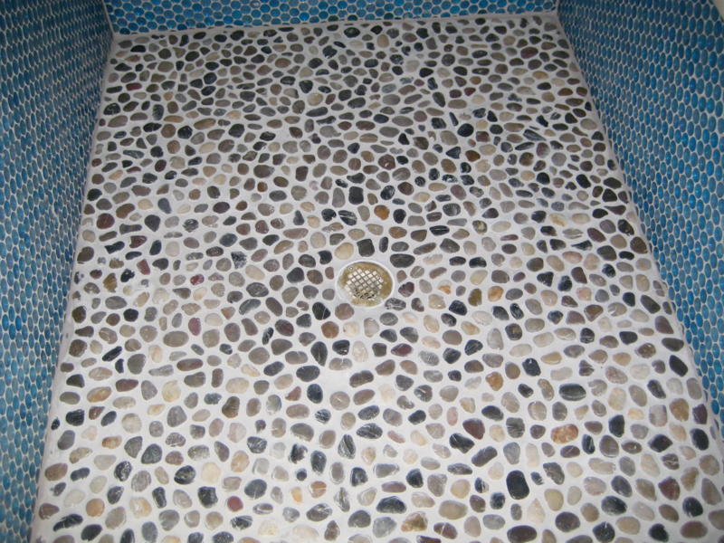 Tile the floor with stone mosaic tiles